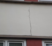Cracked render on wall repaired by P & AS Hayselden Decorators Barnsley